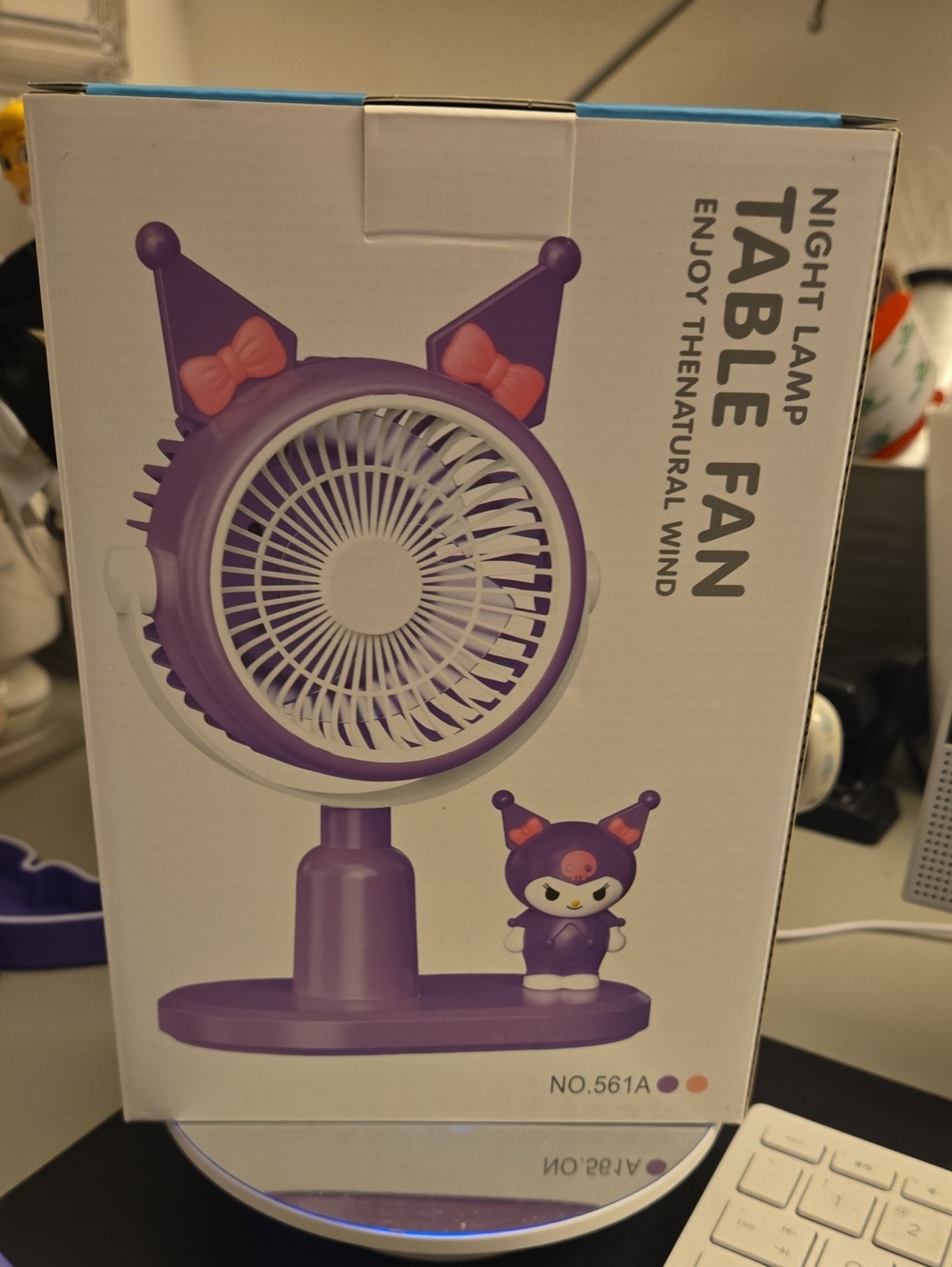 MIni desk fan featuring a purple color Labubu  character figurine